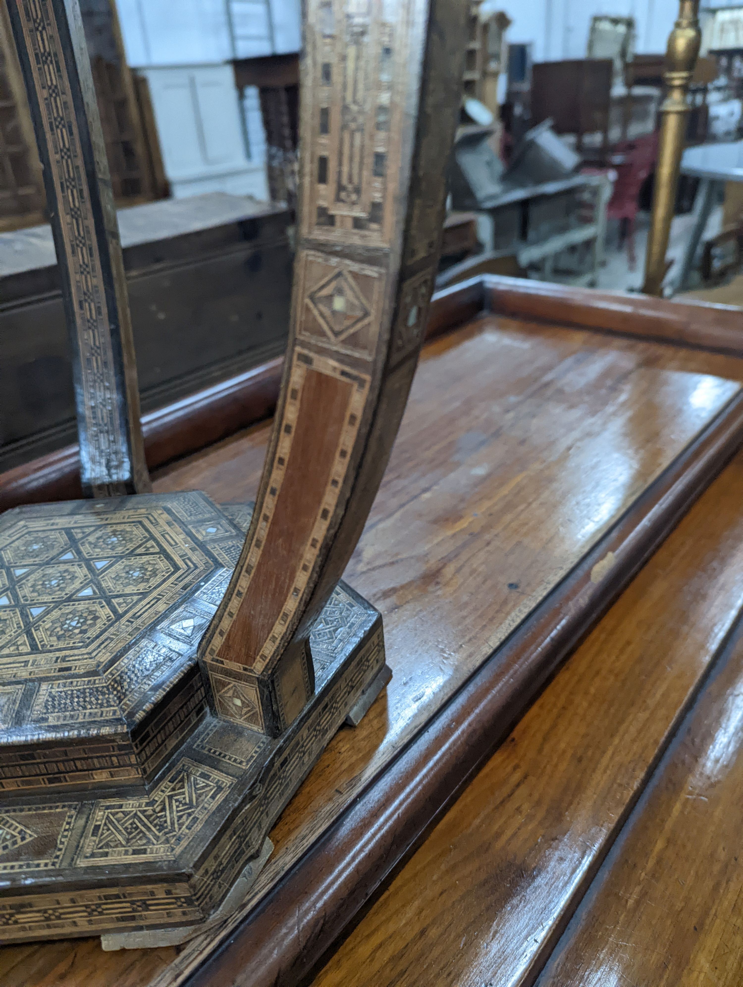 A Moorish bone and parquetry inlaid two tier occasional table, diameter 41cm, height 52cm